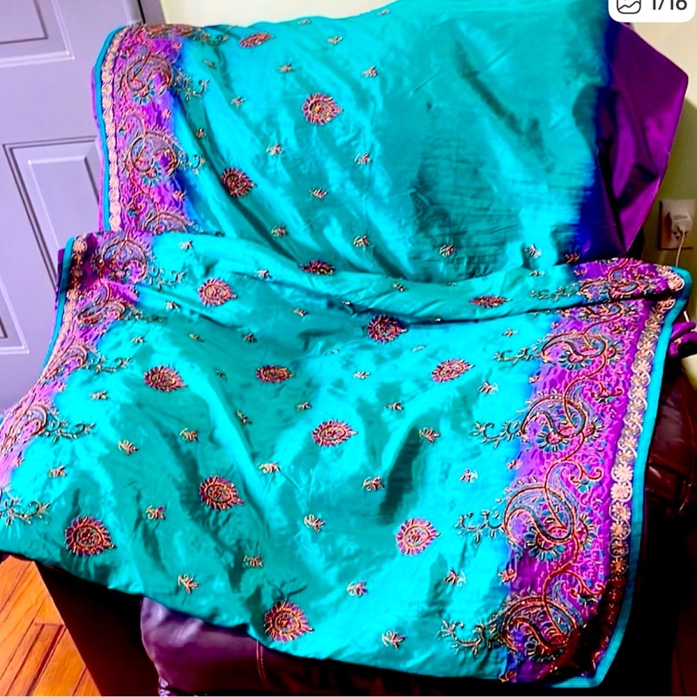 Beautiful, gorgeous ethnic wear with teal green and purple embroidery stones.